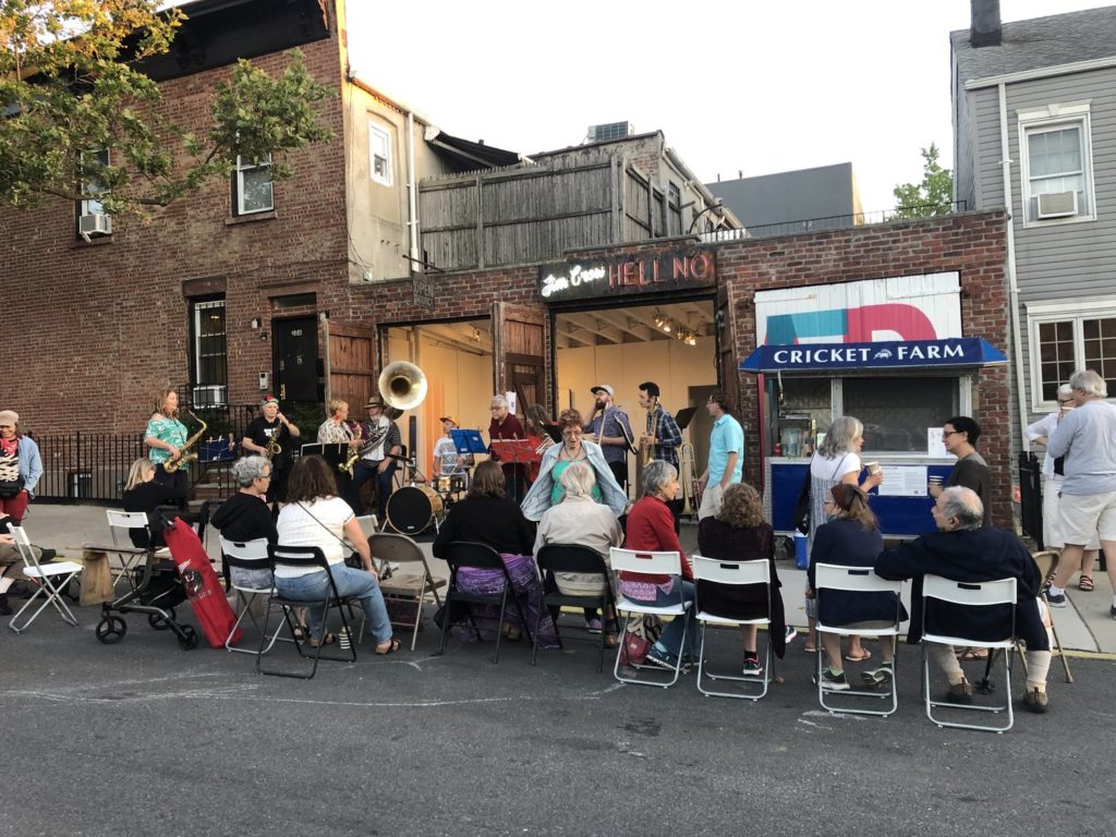 Swunky Z Brass Band playing outdoor show at Open Source Gallery